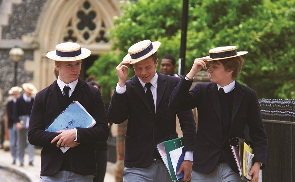 Three young students, in formal school uniform, at a UK Public School.