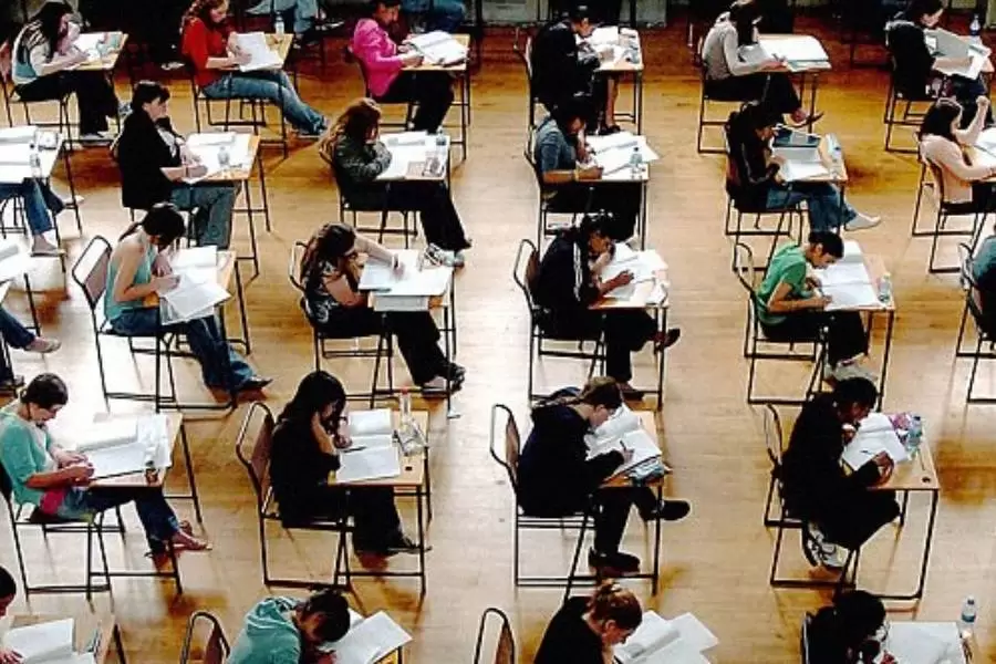 Sixth Form students sitting in an exam hall taking public exams.